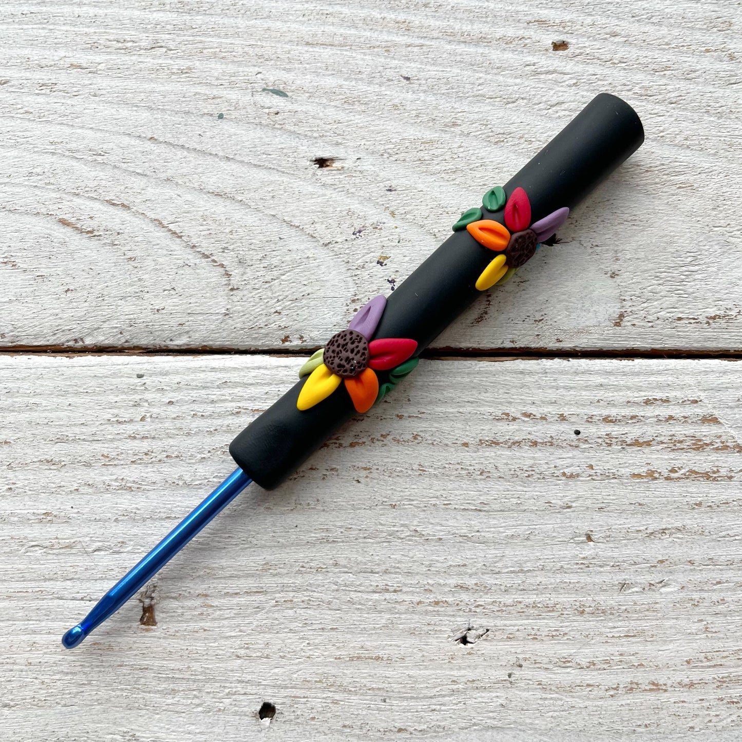 Black rainbow flower polymer clay crochet hook
